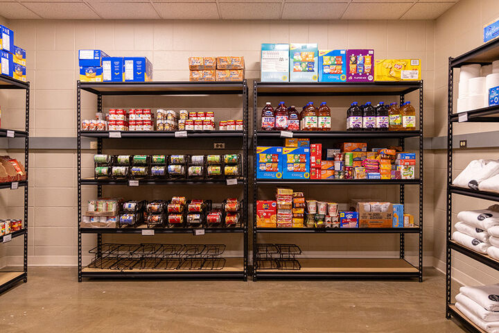 Fully stocked shelves in the Cougar Cupboard food pantry.